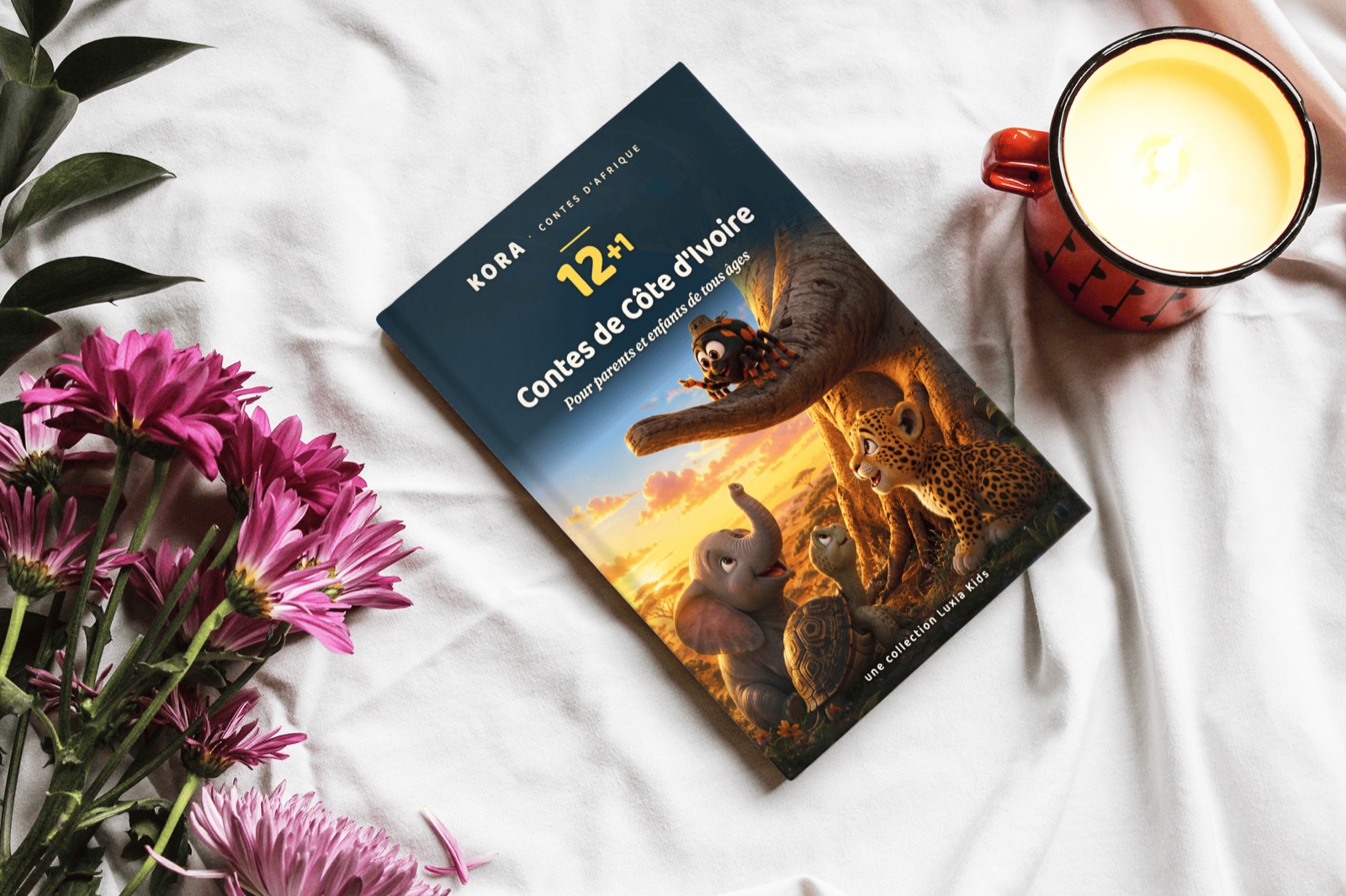 Le livre Kora posé sur le lit, ambiance du soir